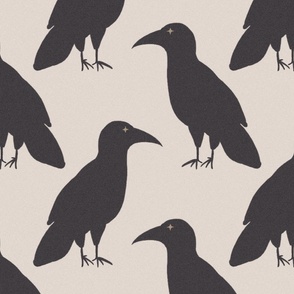 Bold large-scale half-drop repeat of 8-inch stylized charcoal raven silhouettes with antique brass star eyes, alternating directions on warm oatmeal.